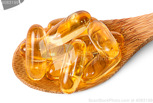 Image of Cod liver oil omega 3 capsules on wooden spoon