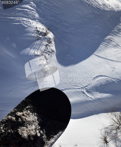 Image of View from chair-lift on snowboard over off-piste slope