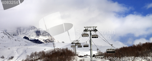 Image of Panoramic view on chair lift on ski resort and snow mountain in 