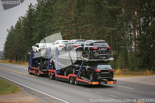 Image of Car Transporter Truck Hauls New Cars on the Road