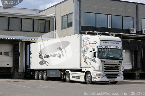 Image of Scania Semi of Finn-Trailer Oy Unloads at Warehouse