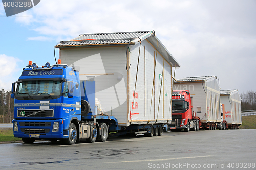 Image of Fleet of Trucks Transport House Modules