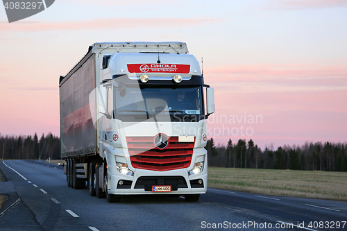 Image of Mercedes-Benz Actros Trucking at Twilight Time