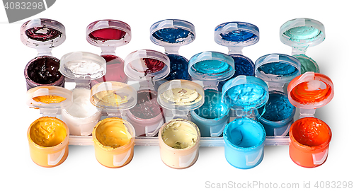 Image of Set of colorful acrylic paints in open jars