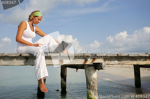 Image of Woman on Jetty with Laptop