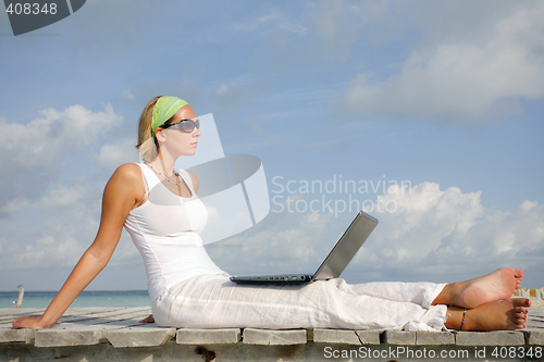 Image of Woman on Jetty with Laptop