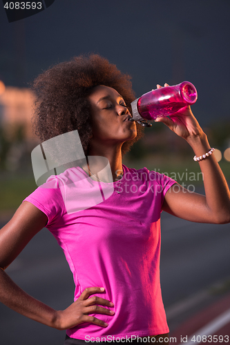 Image of Portrait of a young african american woman running outdoors