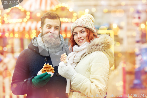 Image of happy couple walking in old town