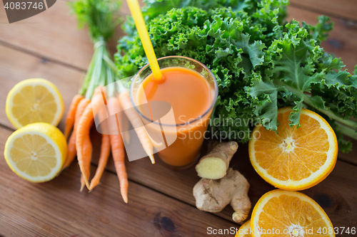 Image of glass of carrot juice, fruits and vegetables