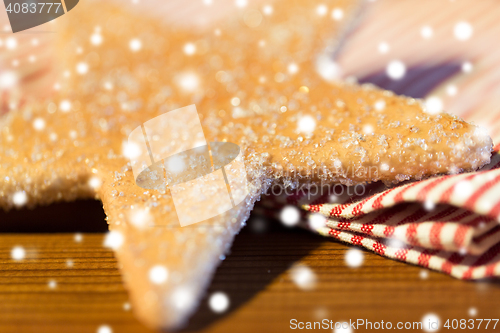 Image of close up of star gingerbread cookie and towel