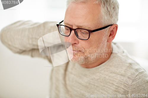 Image of close up of senior man suffering from neck ache