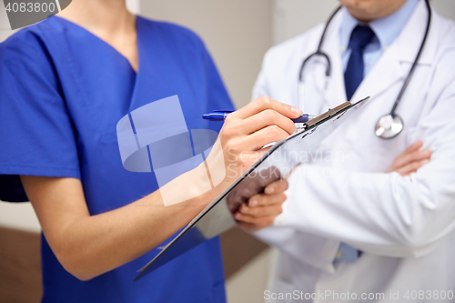 Image of close up of doctors with clipboard at hospital