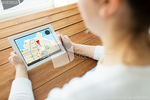 Image of close up of woman with gps navigator on tablet pc