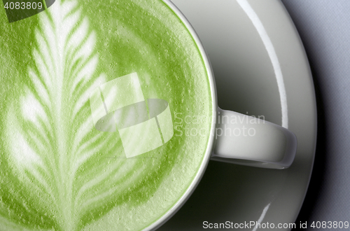 Image of close up of matcha green tea latte in cup