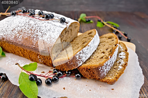 Image of Fruitcake bird cherry cut with berries on board