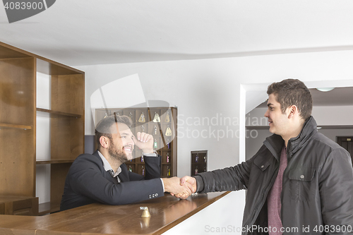Image of At the Hostel Reception