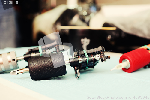 Image of tattoo machine on the background of a  studio