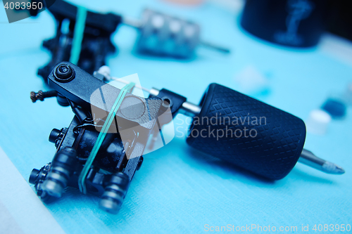 Image of tattoo machine on the background of a  studio