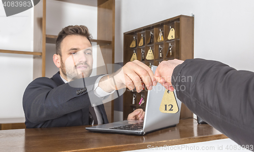 Image of Receptionist Giving the Key