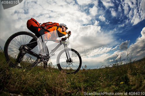 Image of Young man is riding bicycle outside. Healthy Lifestyle.