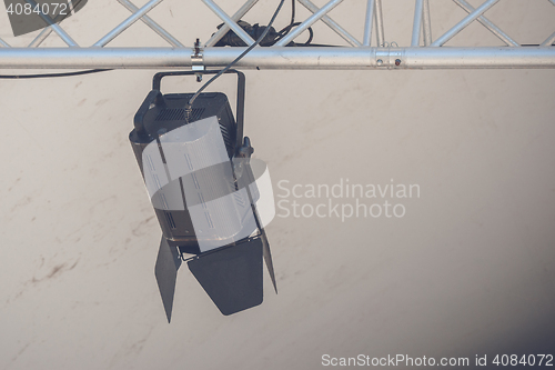 Image of Spotlight lamp hanging on a metal stand