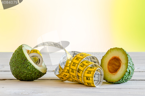 Image of Healthy avocado with measure tape