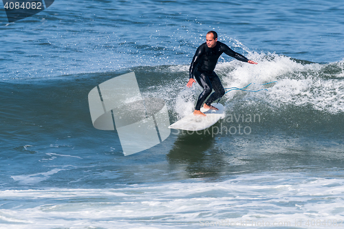 Image of Surfing the waves