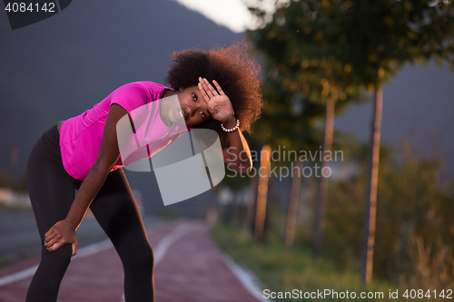 Image of Portrait of a young african american woman running outdoors