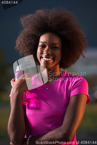 Image of Portrait of a young african american woman running outdoors