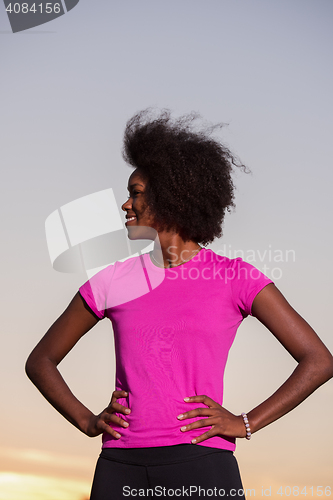 Image of Portrait of a young african american woman running outdoors