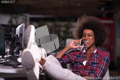 Image of portrait of a young successful African-American woman in modern 