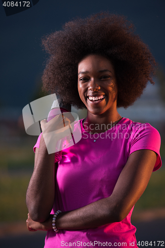 Image of Portrait of a young african american woman running outdoors