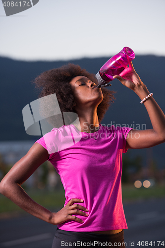 Image of Portrait of a young african american woman running outdoors