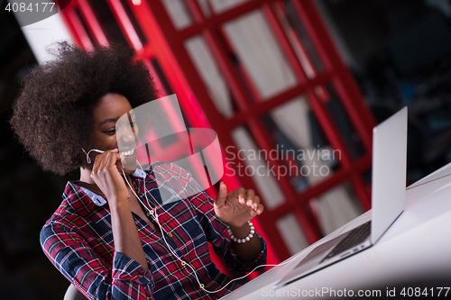 Image of portrait of a young successful African-American woman in modern 