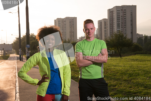 Image of Portrait of romantic pretty couple on fitness session, outside t