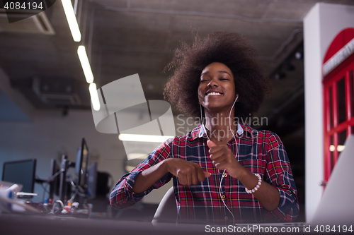 Image of portrait of a young successful African-American woman in modern 