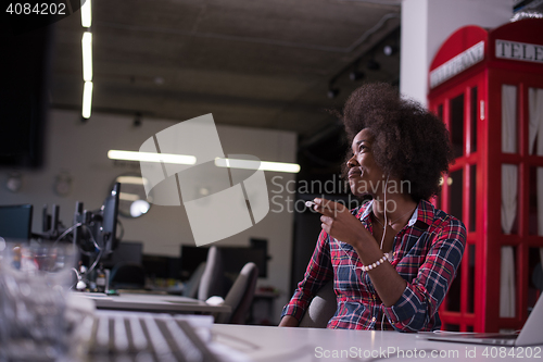 Image of portrait of a young successful African-American woman in modern 