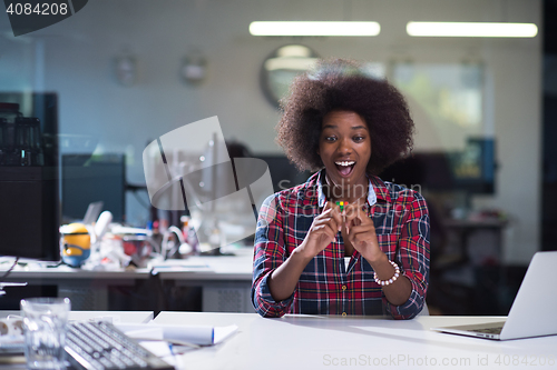 Image of portrait of a young successful African-American woman in modern 