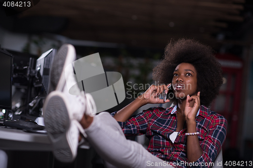 Image of portrait of a young successful African-American woman in modern 