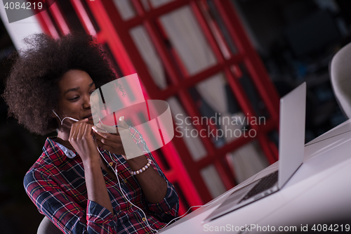 Image of portrait of a young successful African-American woman in modern 