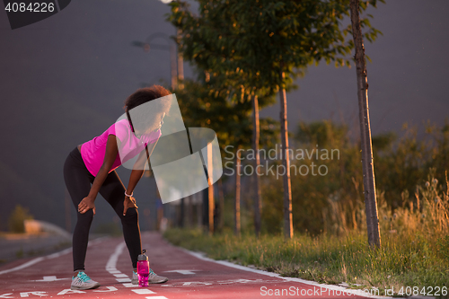 Image of Portrait of a young african american woman running outdoors