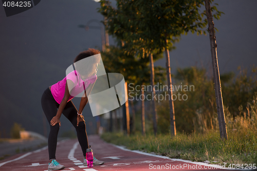 Image of Portrait of a young african american woman running outdoors