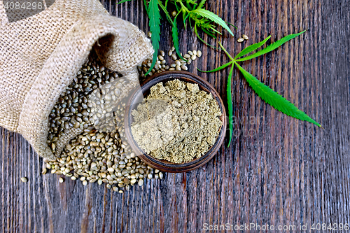 Image of Flour hemp in bowl with grain and bag on board top