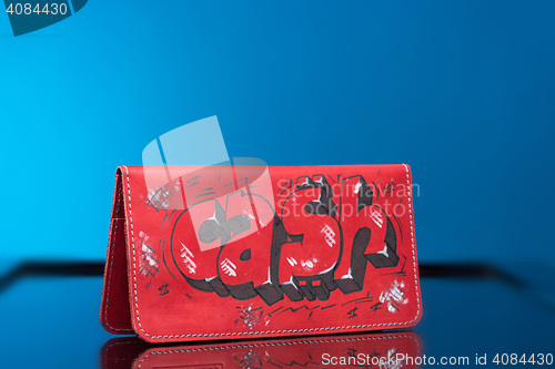 Image of red woman clutch bag. with the words cash