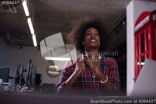 Image of portrait of a young successful African-American woman in modern 