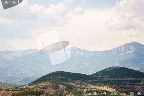 Image of Beautiful uninhabited nature with hills and mountains in the distance