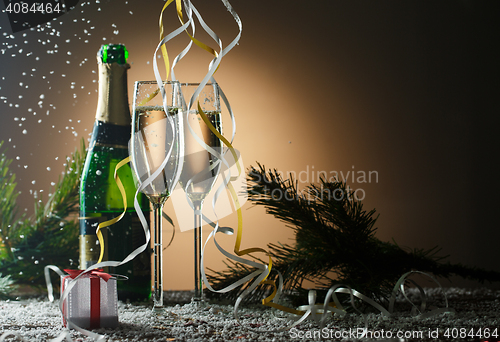 Image of Glasses of champagne with new year and Christmas decorations