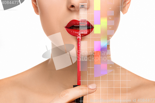 Image of Beautiful female lips with make-up and brush