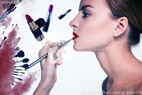 Image of Beautiful female lips with make-up and brush