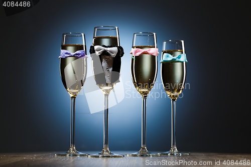 Image of Four elegant stylish champagne glasses. Bachelor party concept
